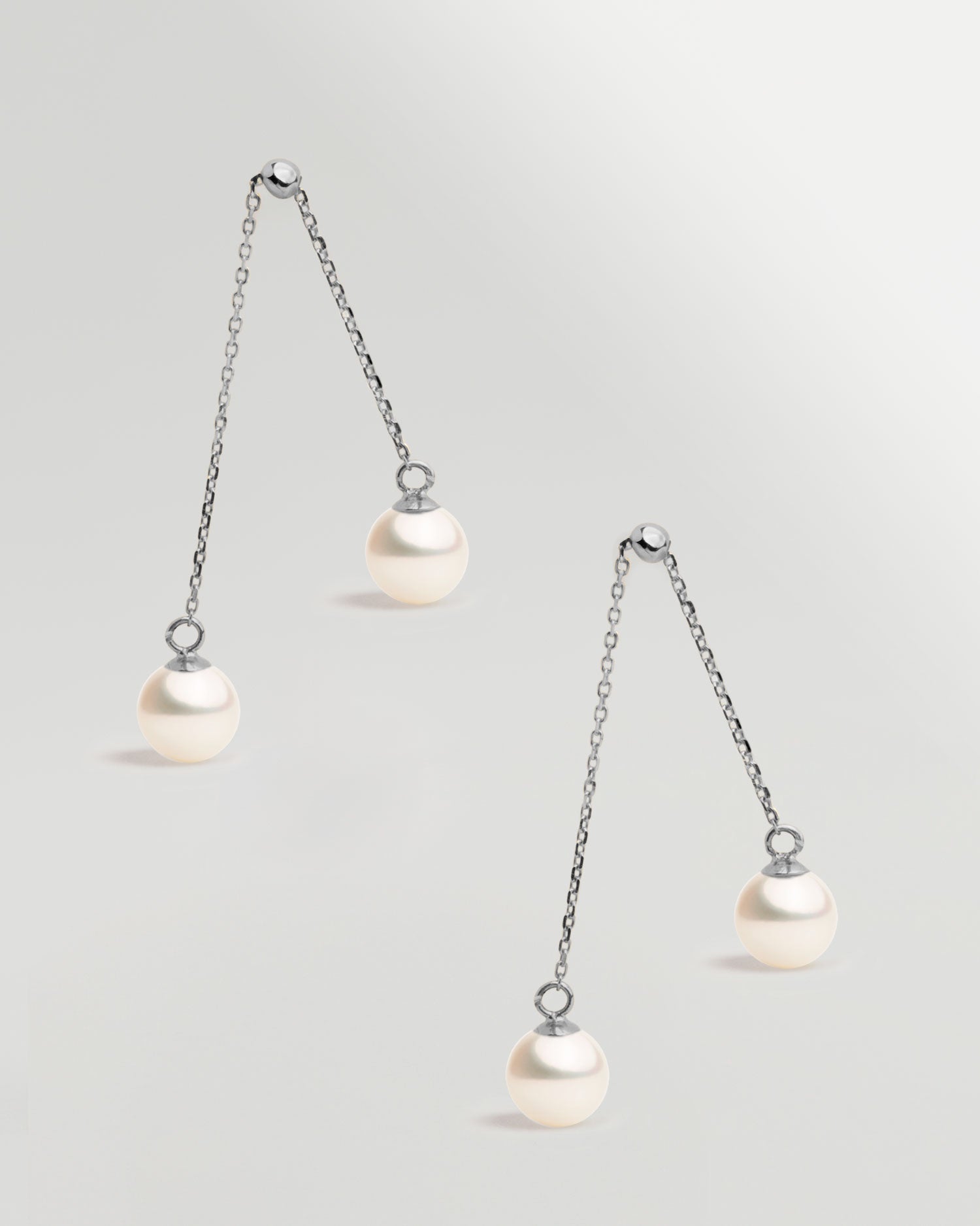 Pendientes de dos perlas redonda colgante en Oro blanco 18k