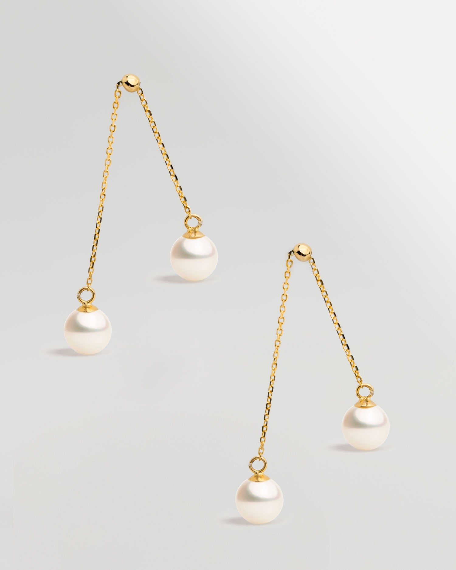 Pendientes de dos perlas redonda colgante en Oro 18k