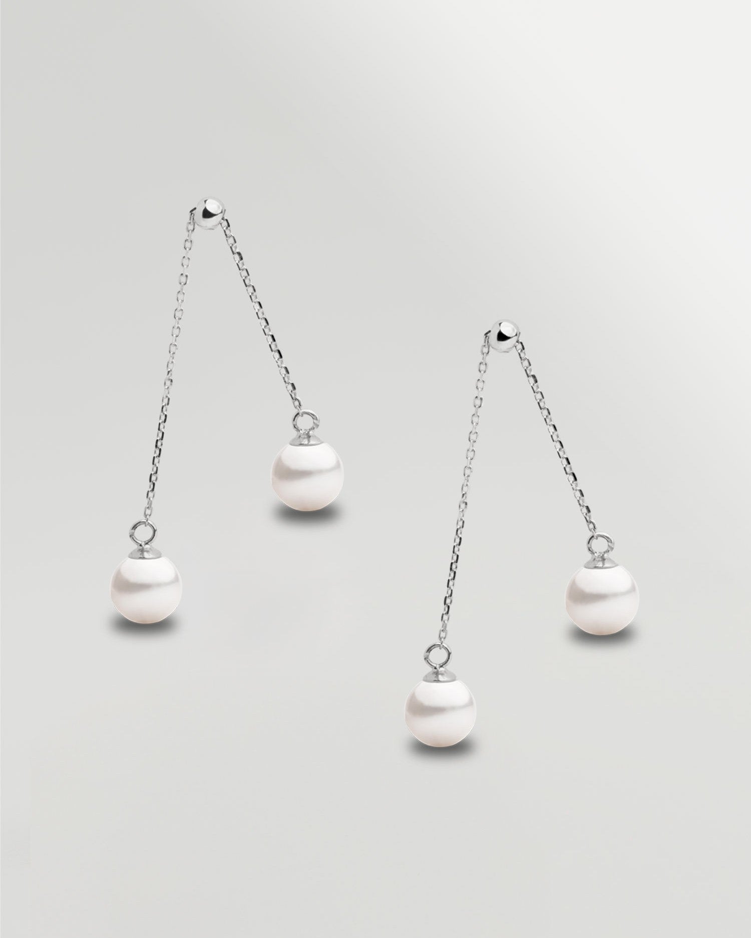 Pendientes de dos perlas redonda colgante en Oro blanco 18k